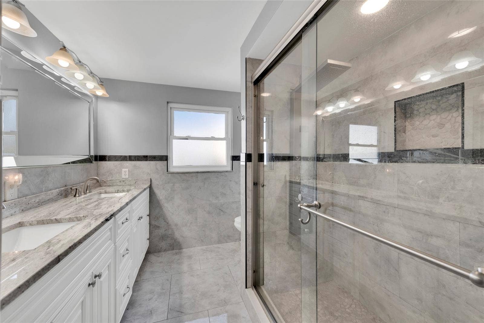 Primary EnSuite Bath ~ Dual Sinks ~ Stone ~ Updated Throughout
