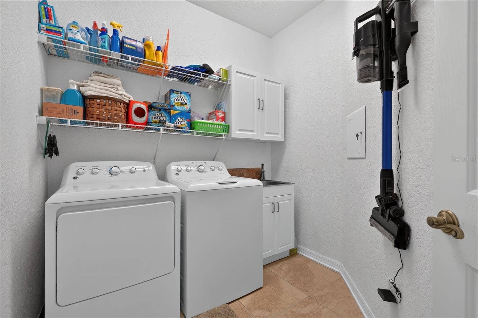 1360 EMERALD DUNES DRIVE, Sun City Center, FL 33573 Laundry room with sink