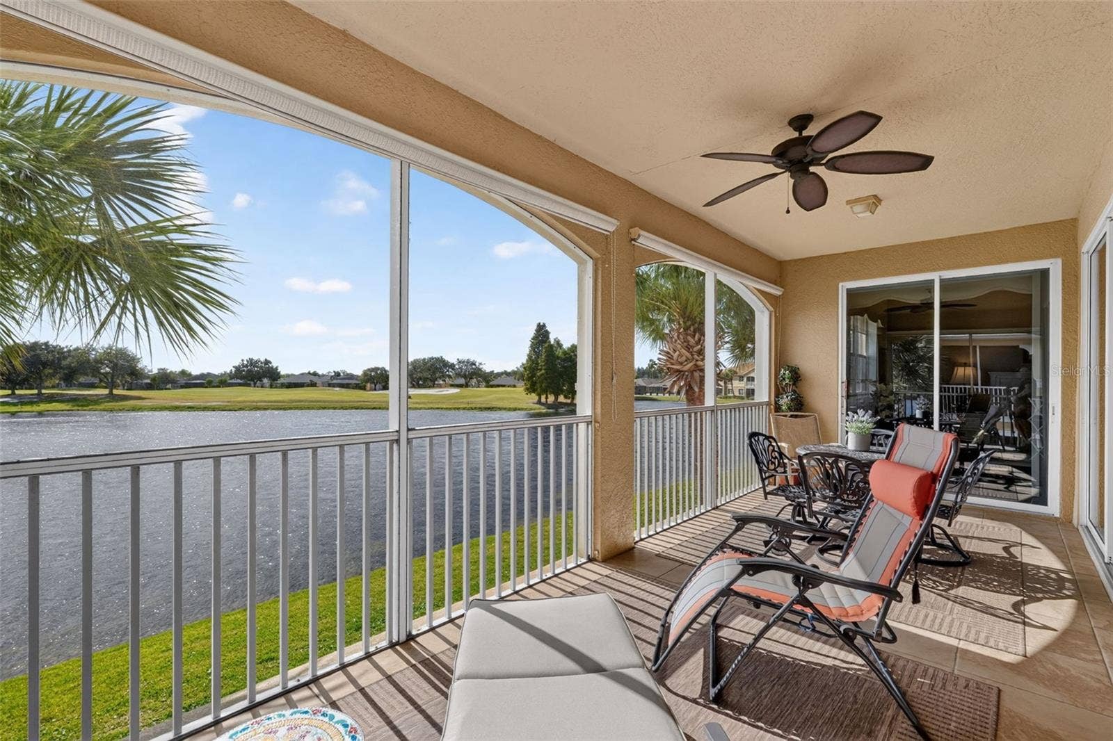 1360 EMERALD DUNES DRIVE, Sun City Center, FL 33573 Screened balcony with water view