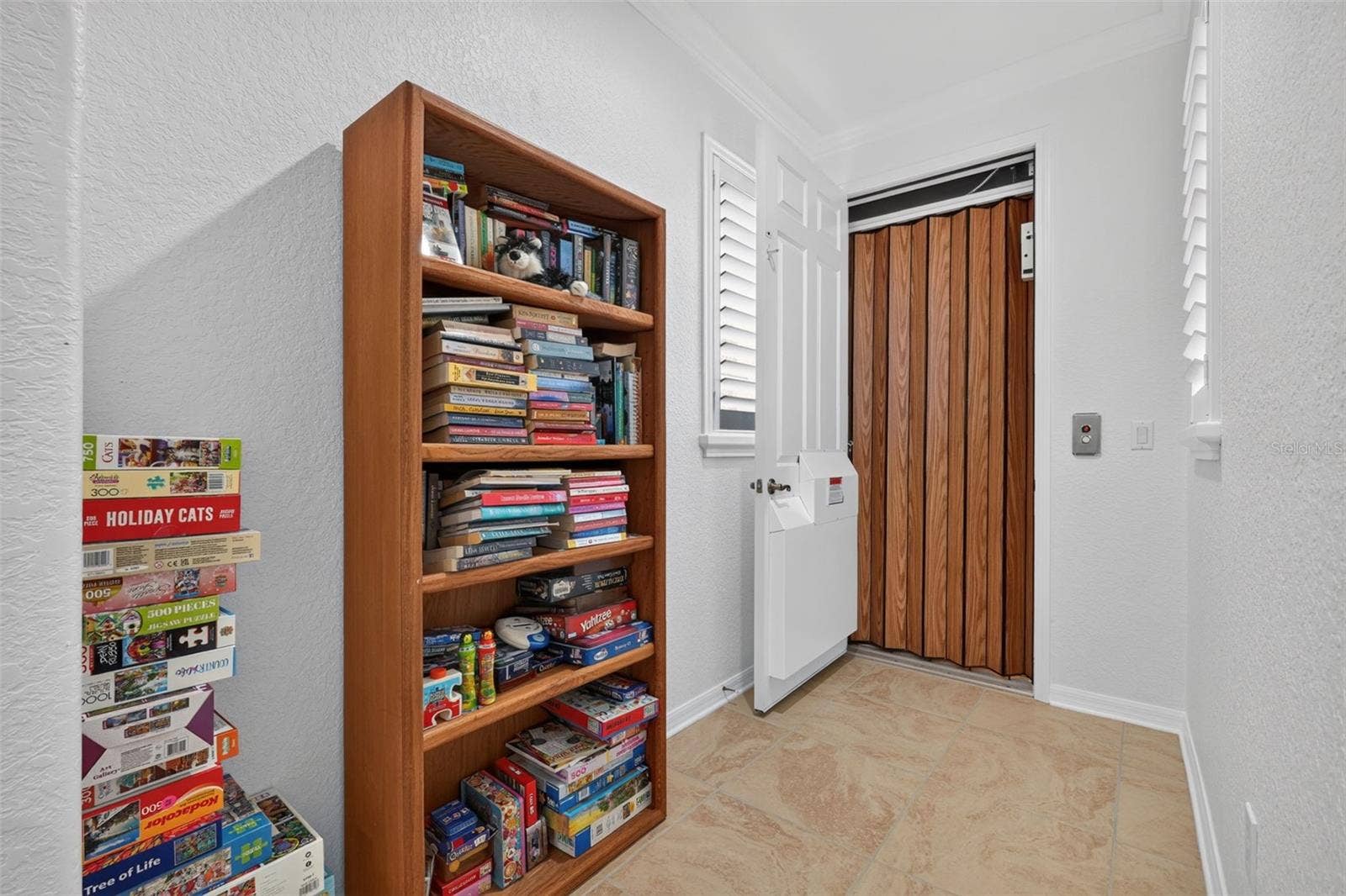 1360 EMERALD DUNES DRIVE, Sun City Center, FL 33573 Hallway to 2nd floor elevator