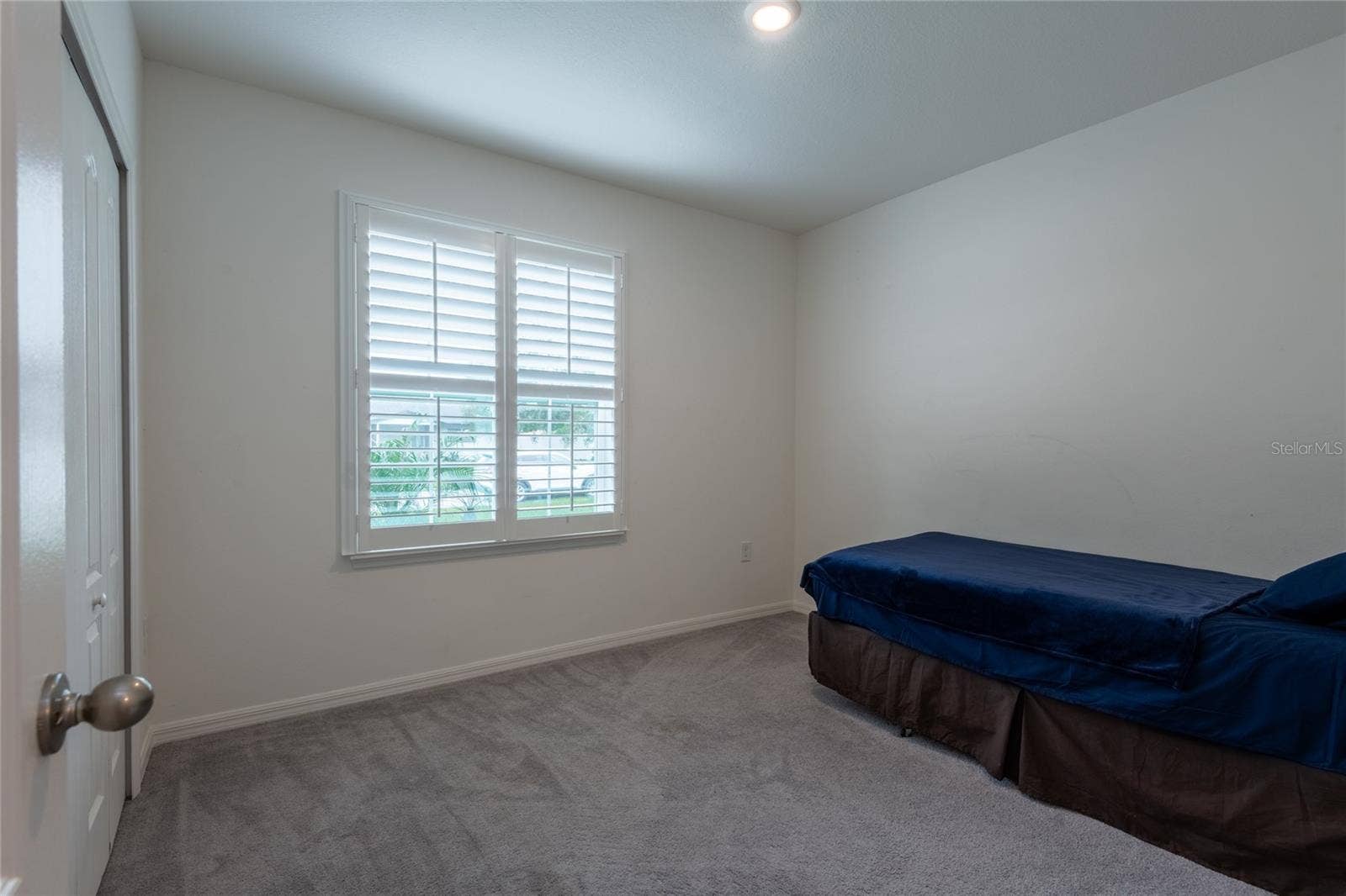 13459 BANYAN ROAD, Spring Hill, FL 34609 2nd front bedroom with plantation shutters.
