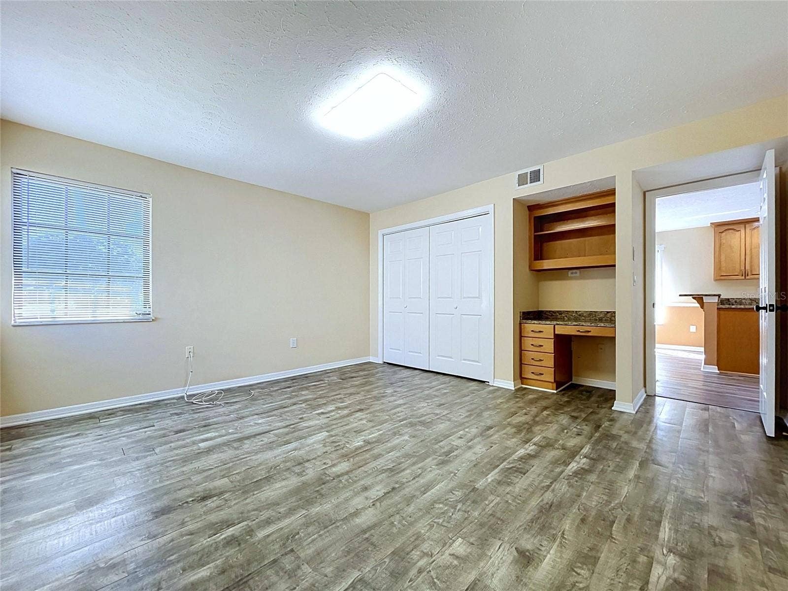 main floor bedroom with bathroom and laundry