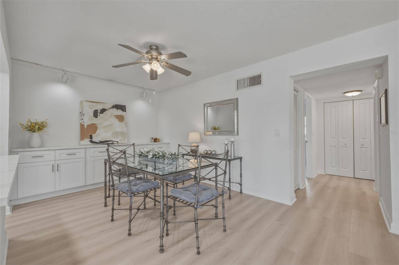 4700 COVE CIRCLE, #111, St Petersburg, FL 33708 Dining room with built-in server/storage cabinets