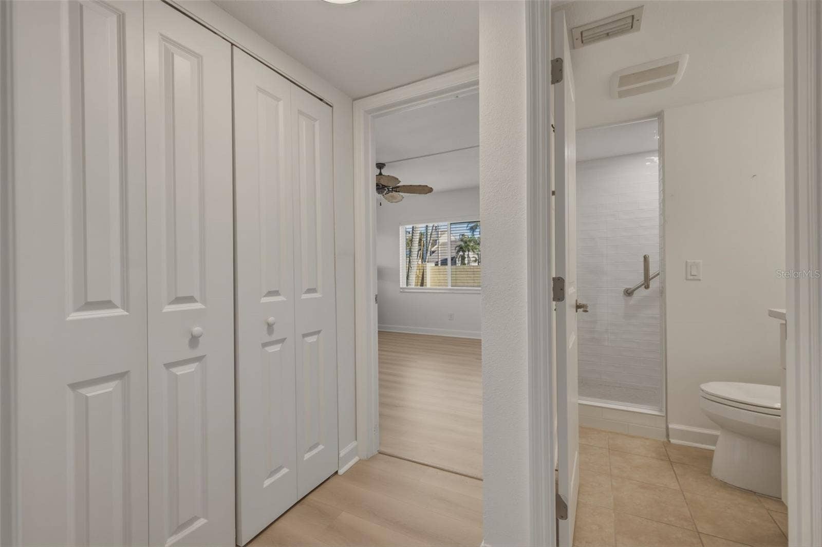 4700 COVE CIRCLE, #111, St Petersburg, FL 33708 hallway to 2nd bedroom and 2nd full guest bathroom