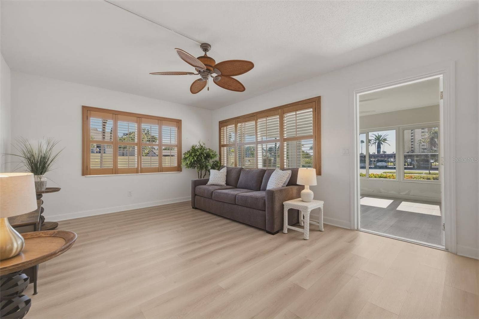 4700 COVE CIRCLE, #111, St Petersburg, FL 33708 Entrance from the sunroom brings you into a spacious family room with end unit lighting throughout!!!