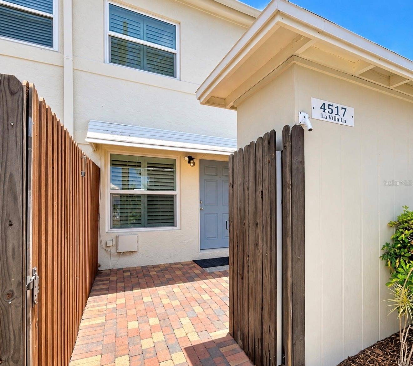 4517 W LA VILLA LANE, Tampa, FL 33611 This is the entrance from the backside, where the parking spot is. You have a private patio area and storage area.