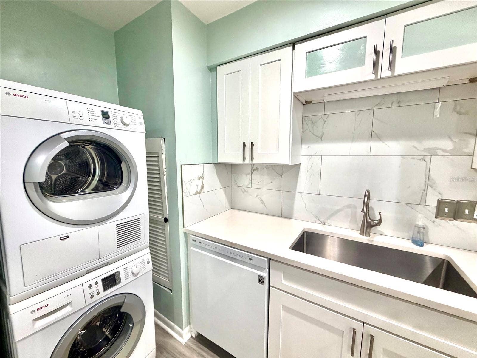4517 W LA VILLA LANE, Tampa, FL 33611 Washer and dryer is located in the kitchen