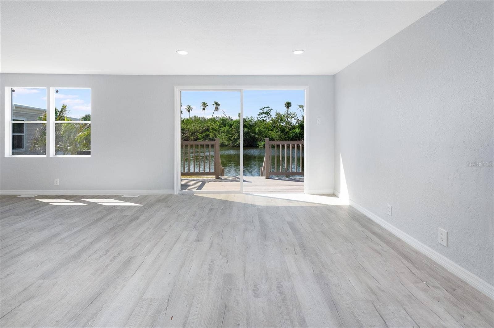 460 MOUNT OAK AVENUE NE, #745, St Petersburg, FL 33702 Livingroom facing waterfront canal to Tampa Bay