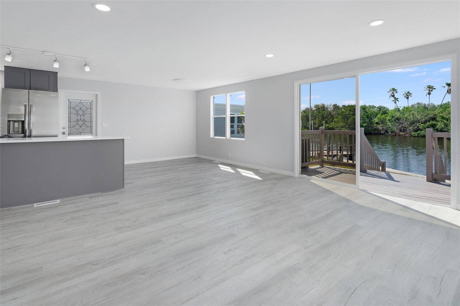 460 MOUNT OAK AVENUE NE, #745, St Petersburg, FL 33702 Livinroom facing kitchen island east and waterfront