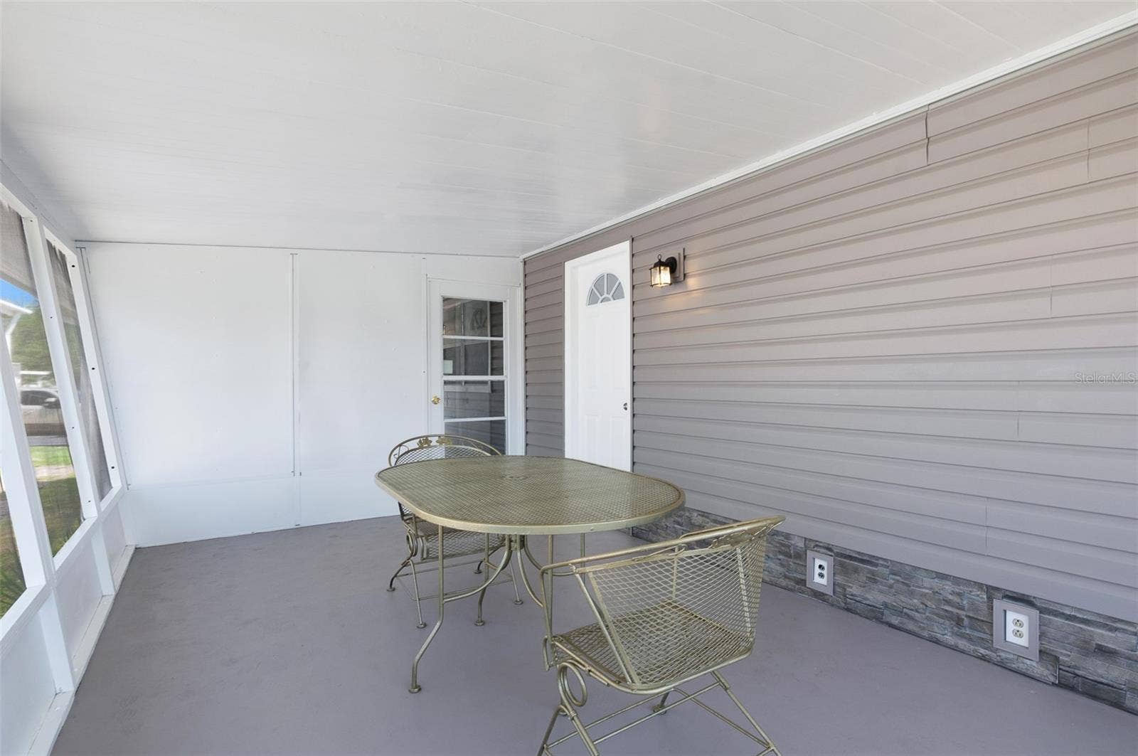 460 MOUNT OAK AVENUE NE, #745, St Petersburg, FL 33702 covered screened patio