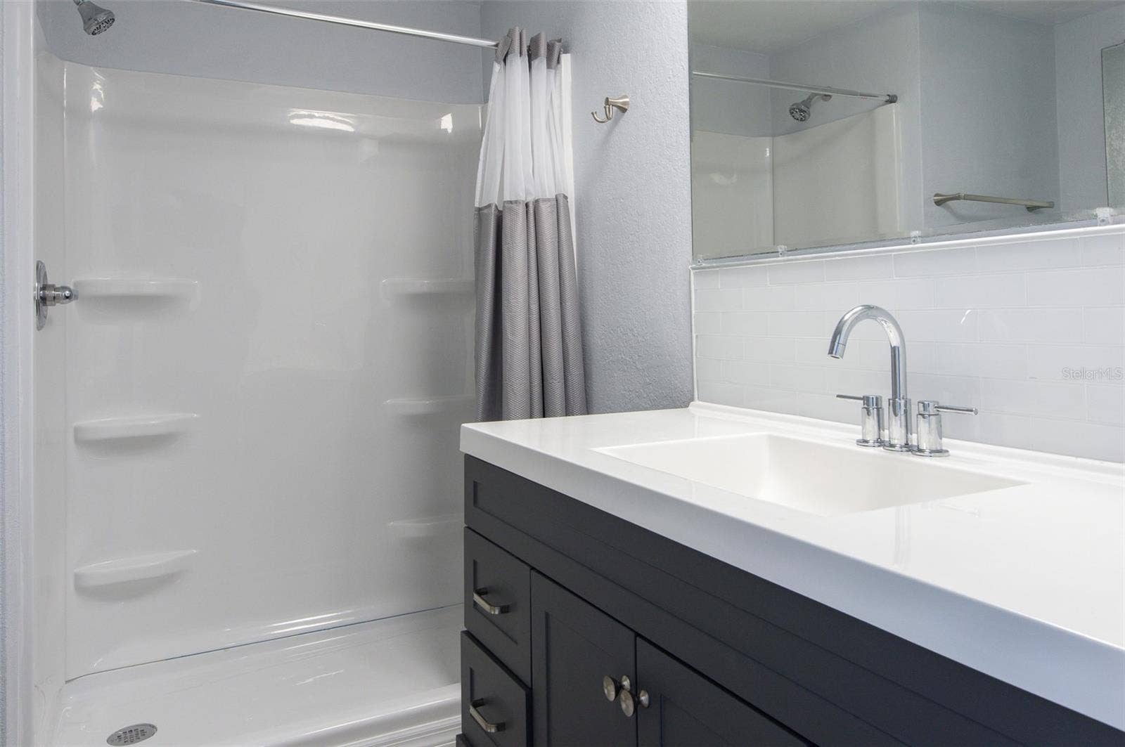 460 MOUNT OAK AVENUE NE, #745, St Petersburg, FL 33702 main bathroom Vanity and walk in shower