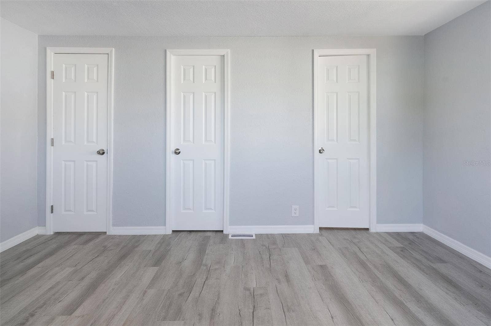460 MOUNT OAK AVENUE NE, #745, St Petersburg, FL 33702 Bedroom 1 Left door to hallway, center door to walk in closet, right door to bathroom