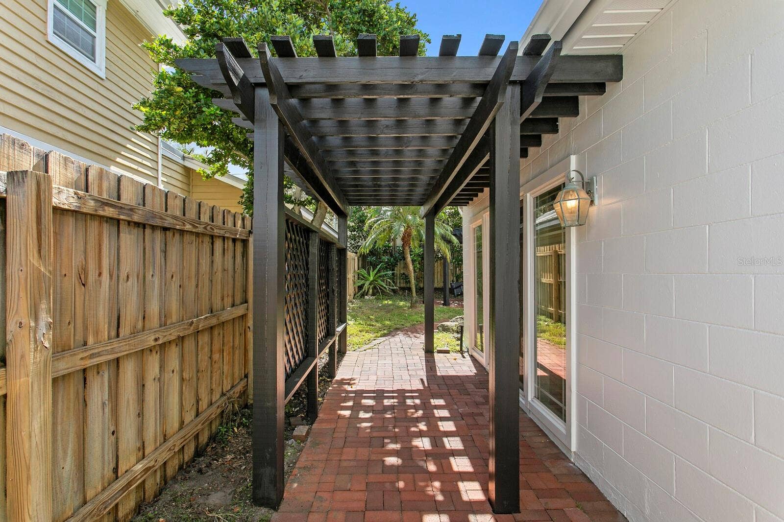 2930 W BAYSHORE COURT, Tampa, FL 33611 Outside the bonus room. Great for hammock to relax.