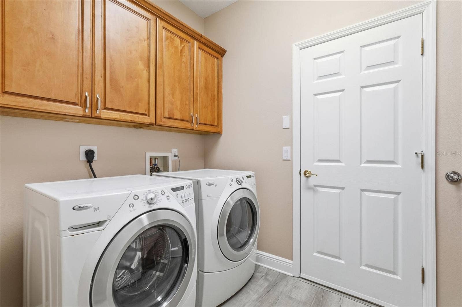 9718 TAYLOR ROSE LANE, Seminole, FL 33777 Inside laundry room