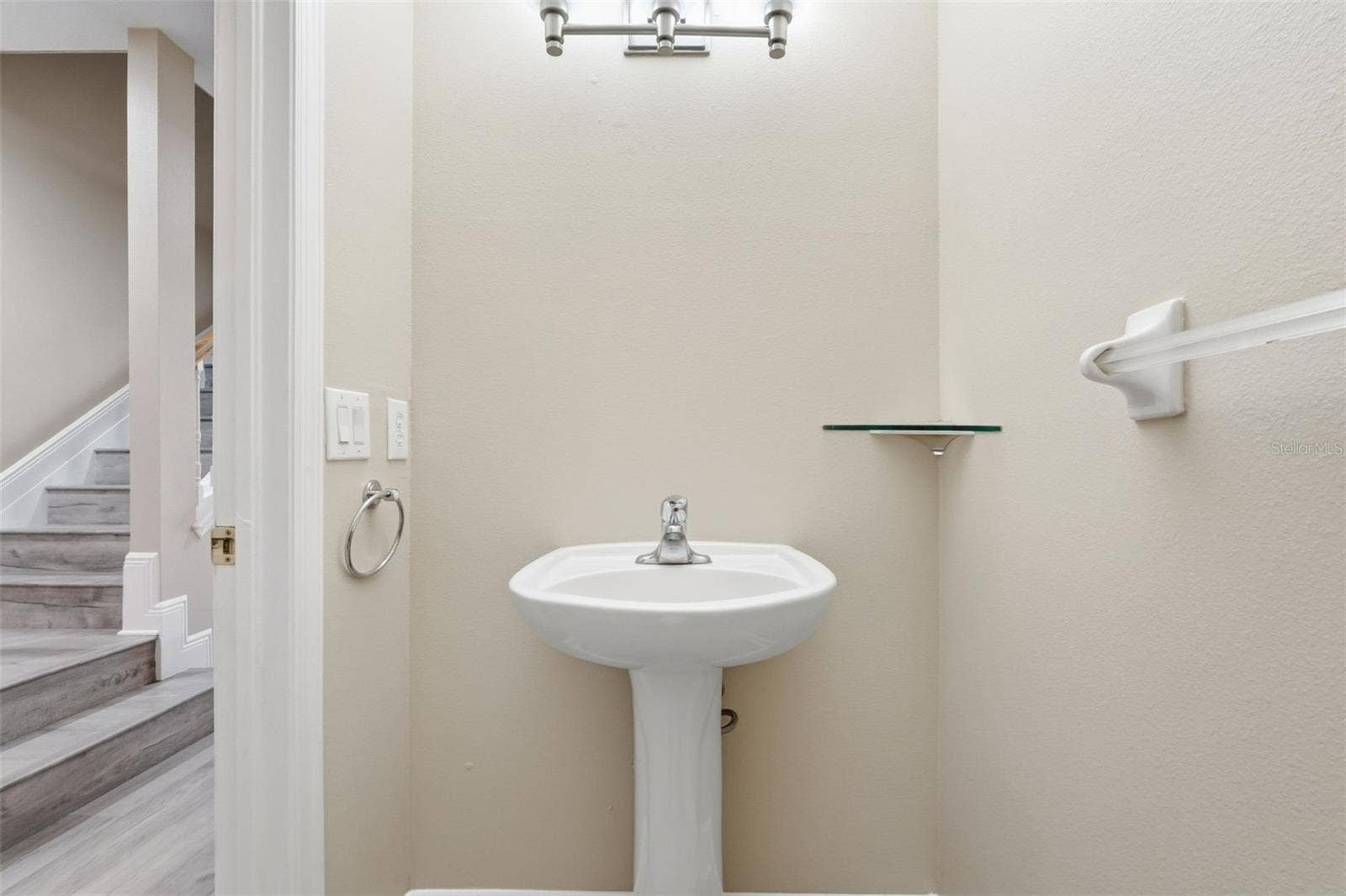 9718 TAYLOR ROSE LANE, Seminole, FL 33777 Half bathroom on the first floor