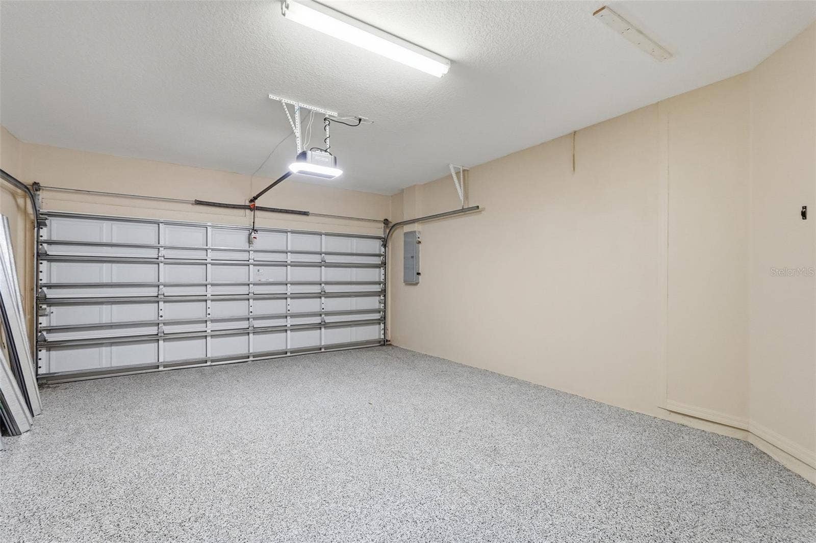 9718 TAYLOR ROSE LANE, Seminole, FL 33777 Beautiful flooring in the garage
