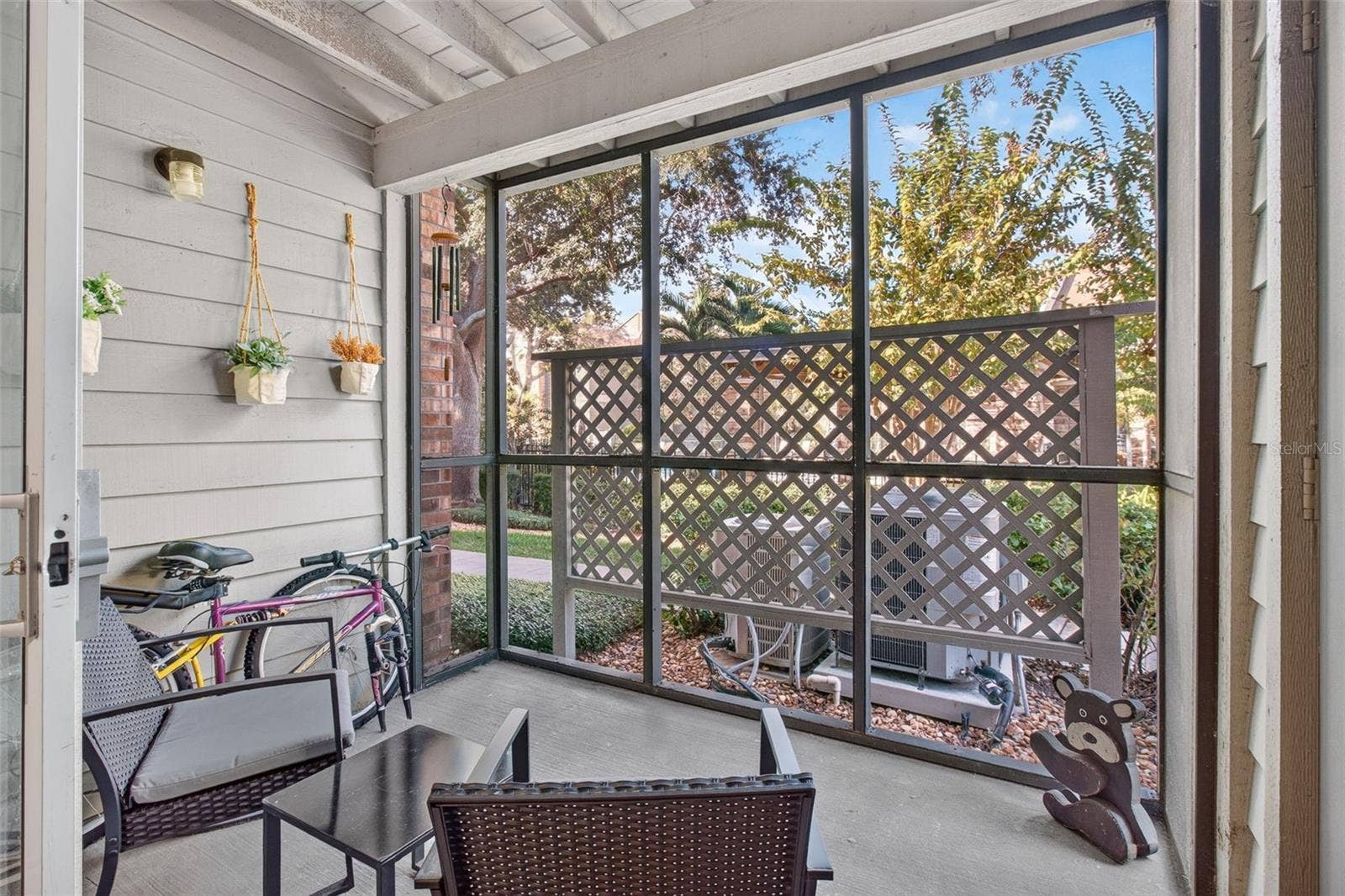 2500 WINDING CREEK BOULEVARD, #I106, Clearwater, FL 33761 Rear screened-in porch facing north, pool view
