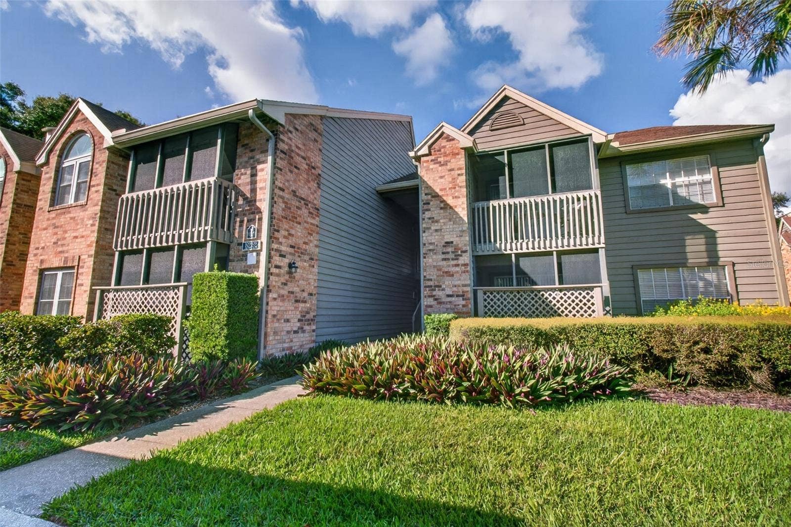 2500 WINDING CREEK BOULEVARD, #I106, Clearwater, FL 33761 Entrance to unit between the buildings.