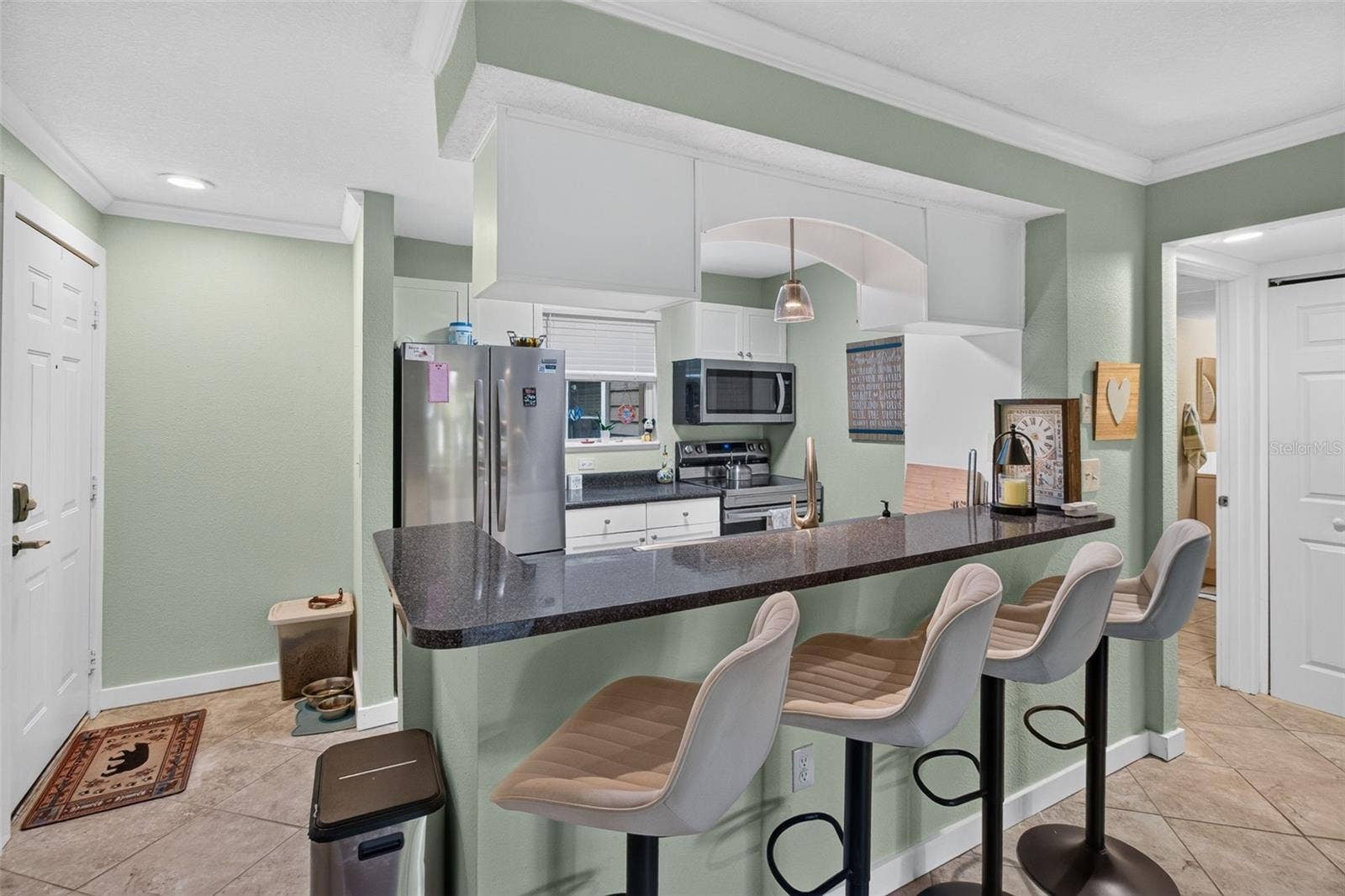 2500 WINDING CREEK BOULEVARD, #I106, Clearwater, FL 33761 View of front door & kitchen