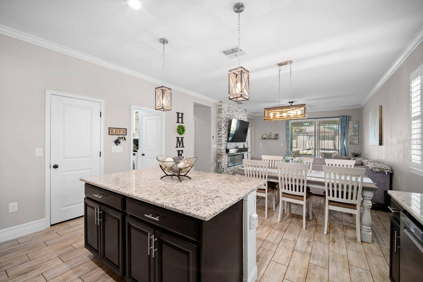10654 PLANER PICKET DRIVE, Riverview, FL 33569 Island view toward the dining area, pantry and laundry hallway