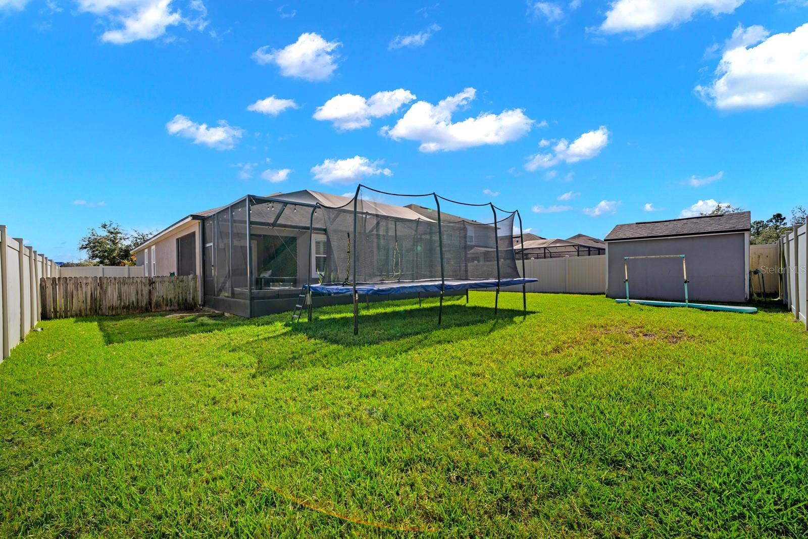 10654 PLANER PICKET DRIVE, Riverview, FL 33569 Backyard view of the screened lanai and storage shed