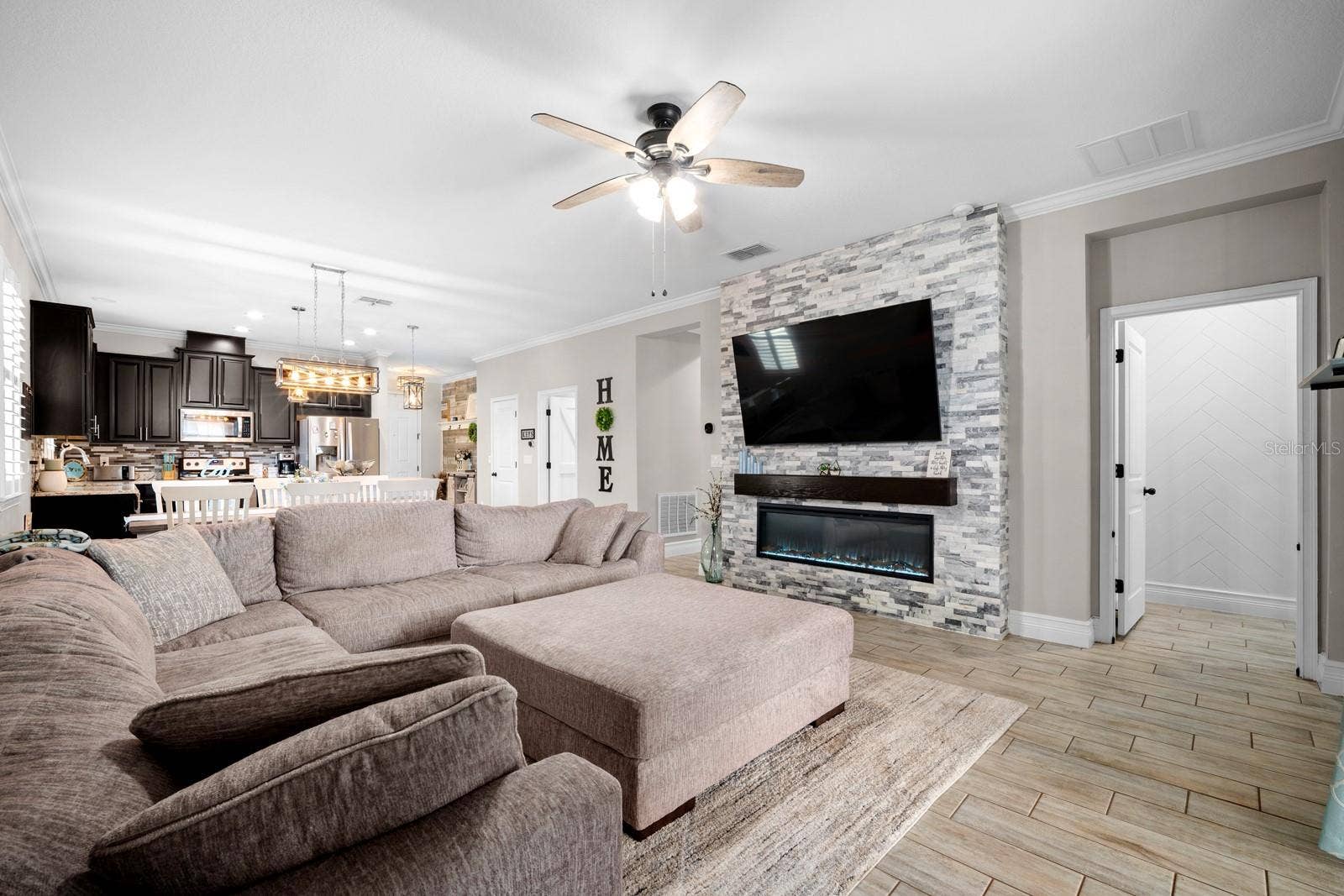 10654 PLANER PICKET DRIVE, Riverview, FL 33569 Family room with stacked stone fireplace wall and built-in TV space