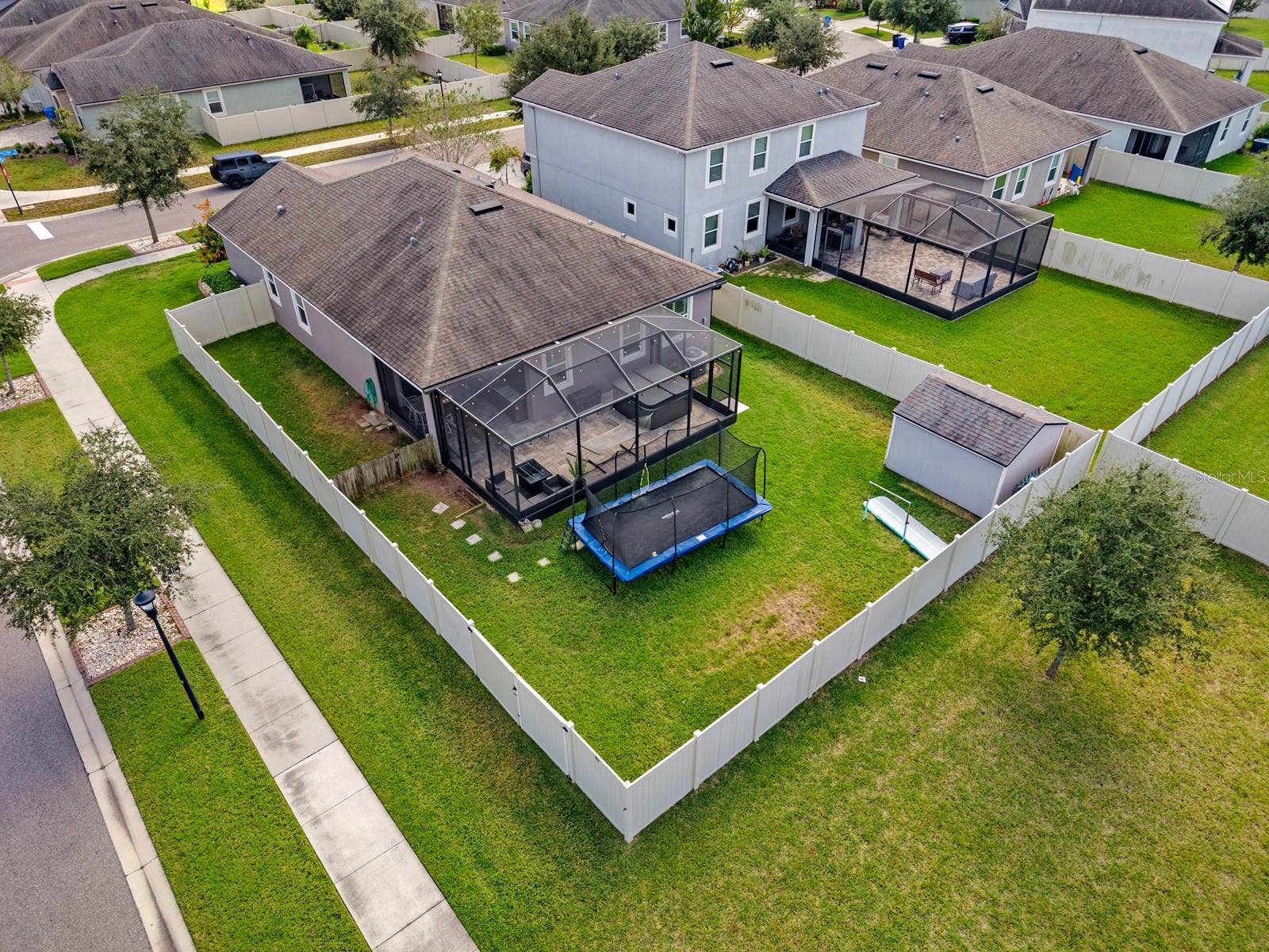 10654 PLANER PICKET DRIVE, Riverview, FL 33569 Aerial view of the fenced backyard, screened lanai and shed
