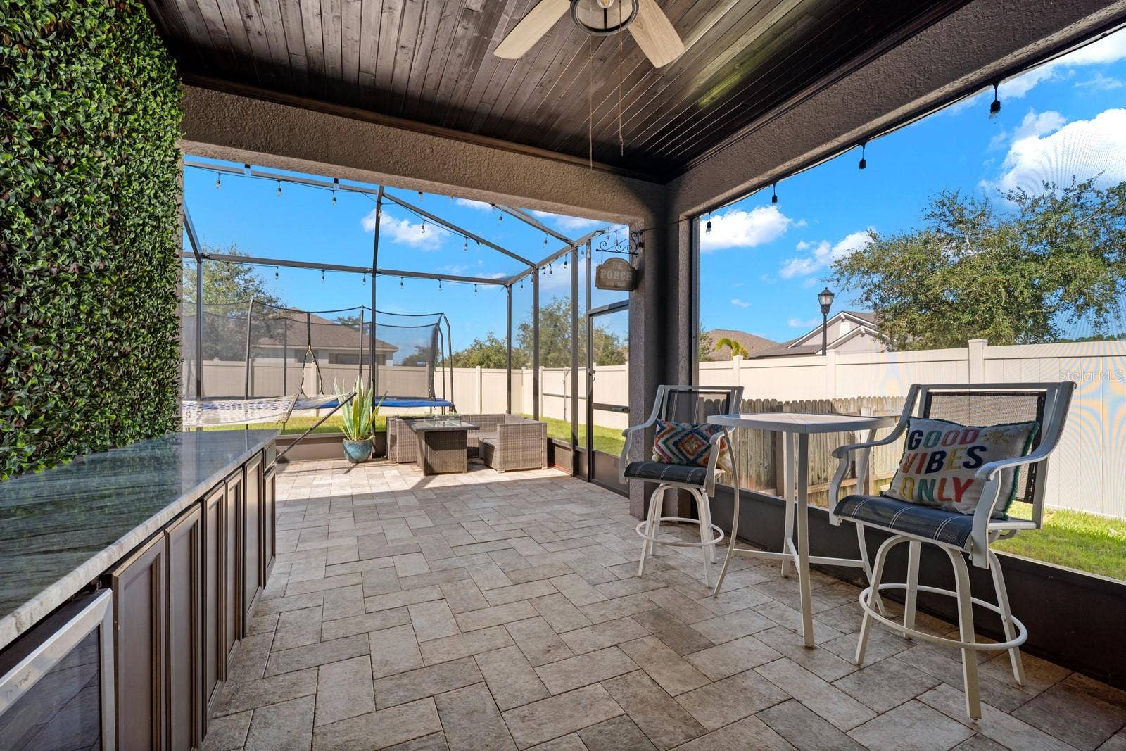 10654 PLANER PICKET DRIVE, Riverview, FL 33569 Screened lanai with bar seating and paver flooring