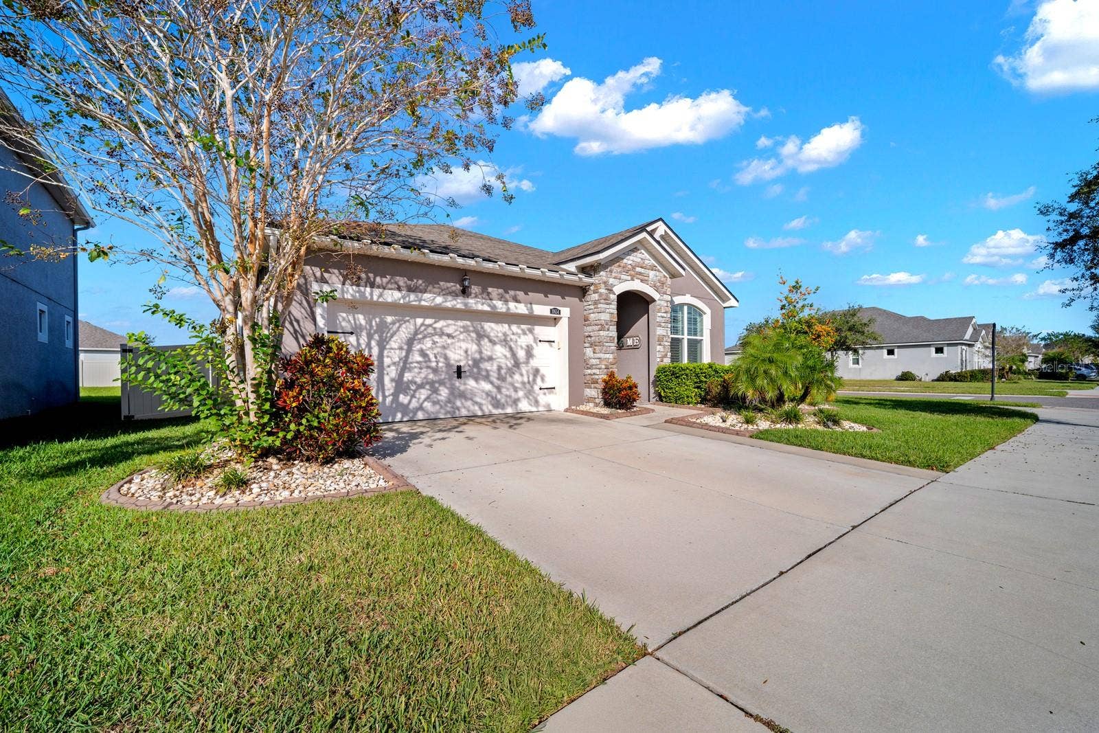 10654 PLANER PICKET DRIVE, Riverview, FL 33569 Street view of the home with wide driveway and established front yard