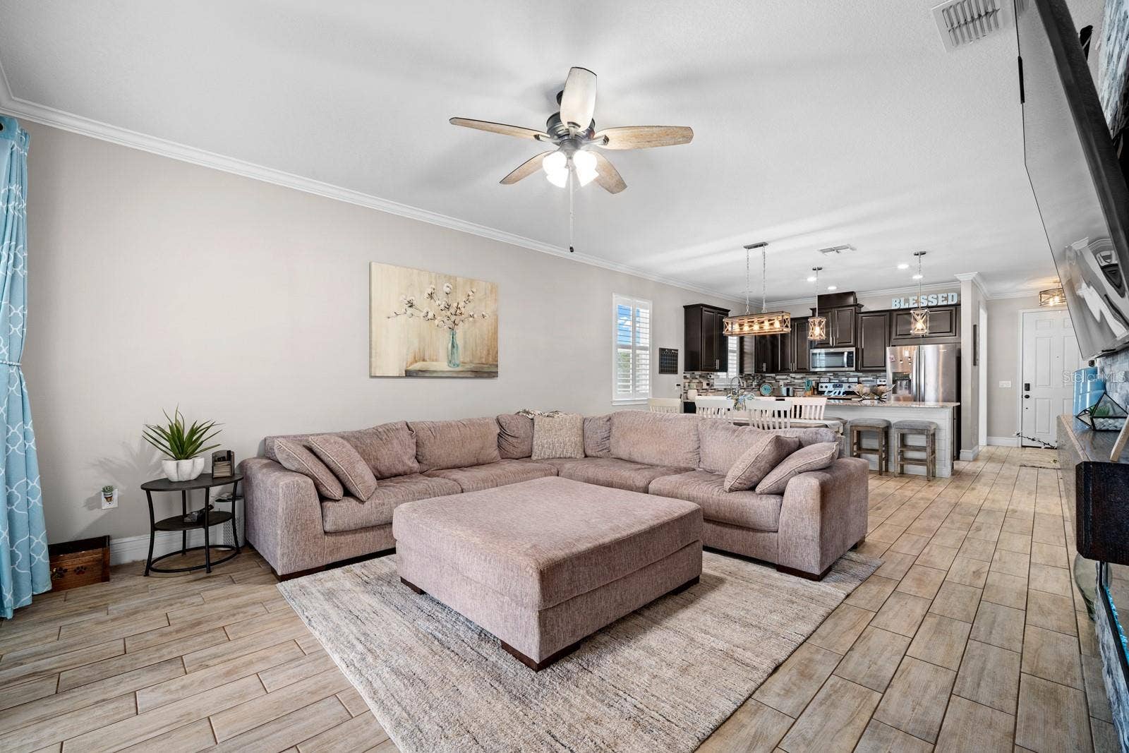 10654 PLANER PICKET DRIVE, Riverview, FL 33569 Family room with ceiling fan, open to the kitchen and dining area
