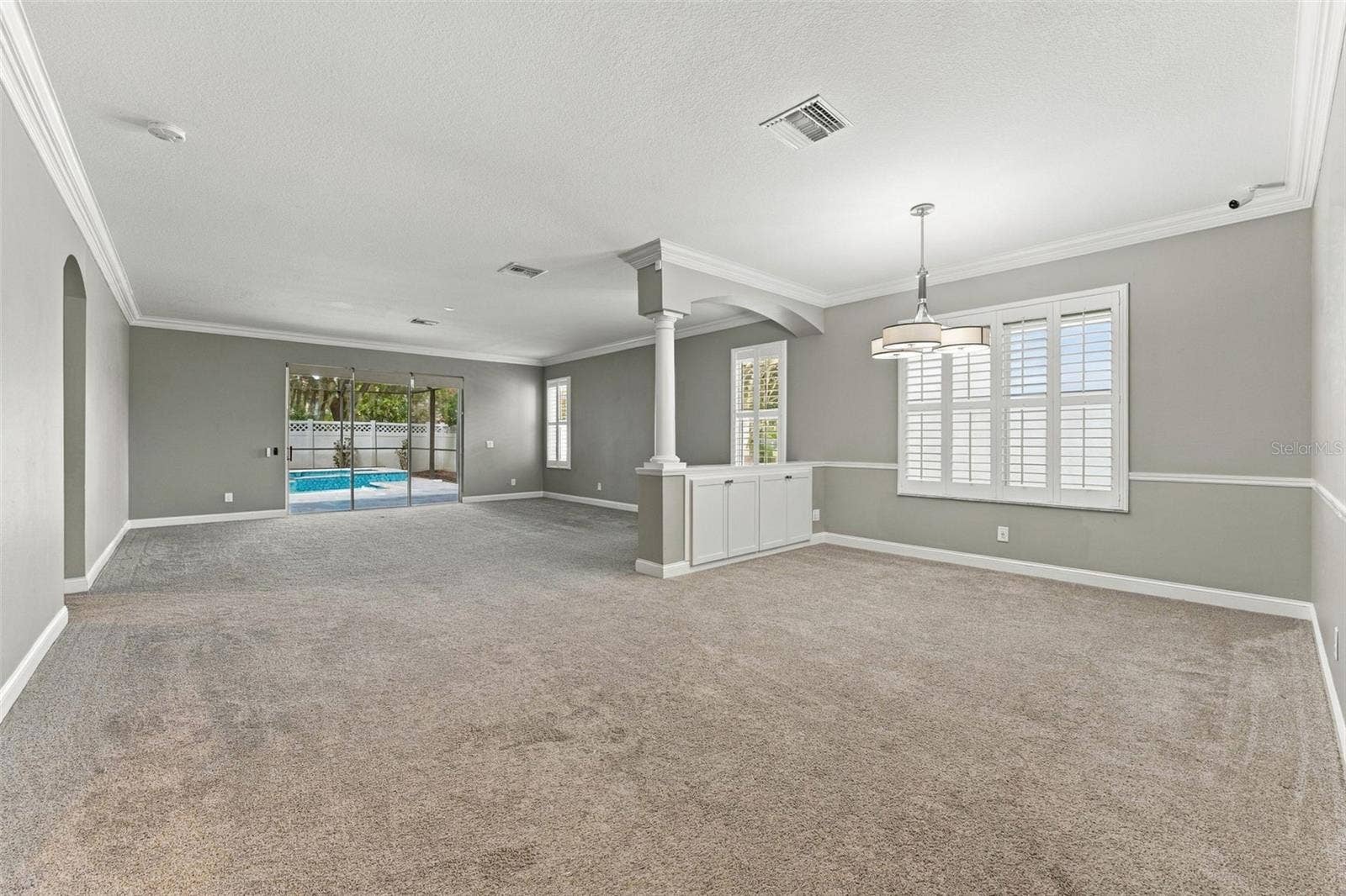 4319 RUSTIC PINE PLACE, Wesley Chapel, FL 33544 Dining / Family Room with new Carpet 2024