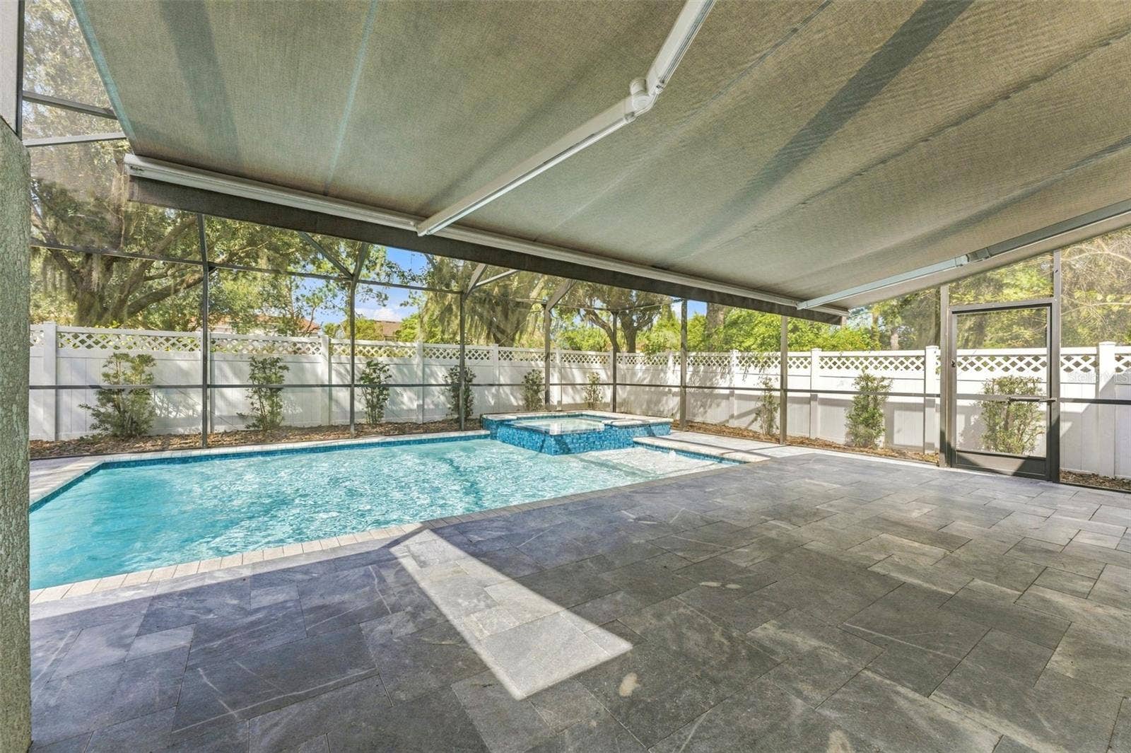 4319 RUSTIC PINE PLACE, Wesley Chapel, FL 33544 Motorized Retractable Awning with lights