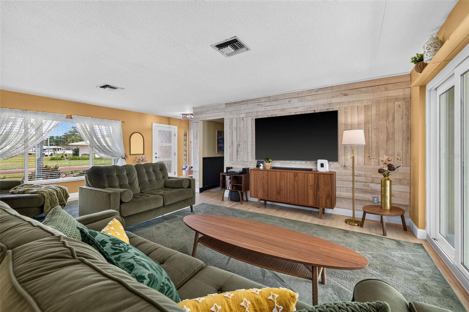 Foyer and living room with sliders to back porch