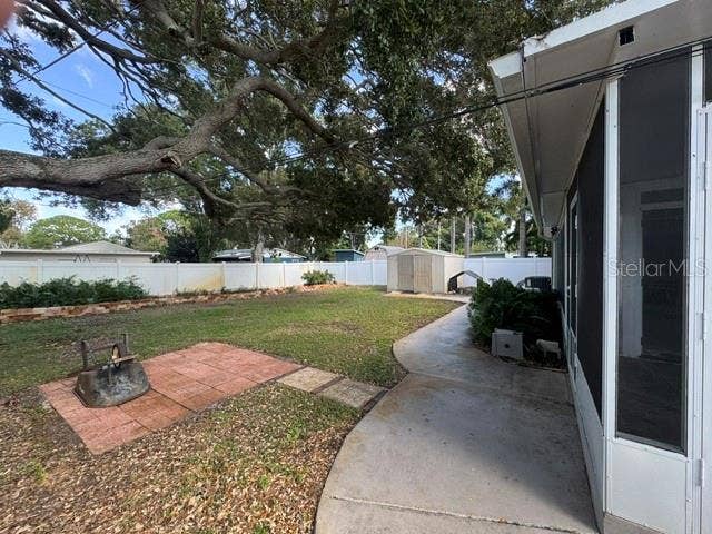 5717 15TH AVENUE N, St Petersburg, FL 33710 West side view of backyard and storage shed