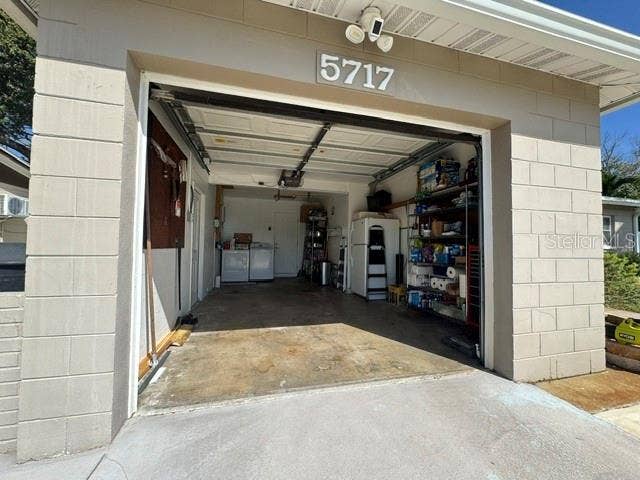 5717 15TH AVENUE N, St Petersburg, FL 33710 Oversized one car garage with storage area to the right of the