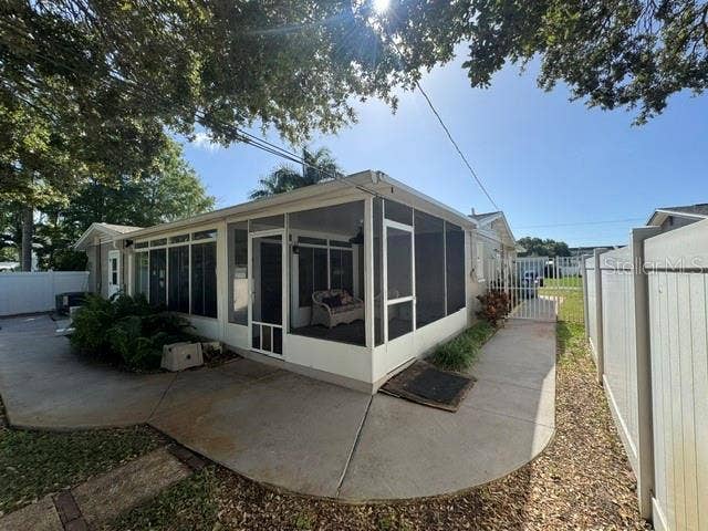 5717 15TH AVENUE N, St Petersburg, FL 33710 Rear view of west side of house including screened back patio