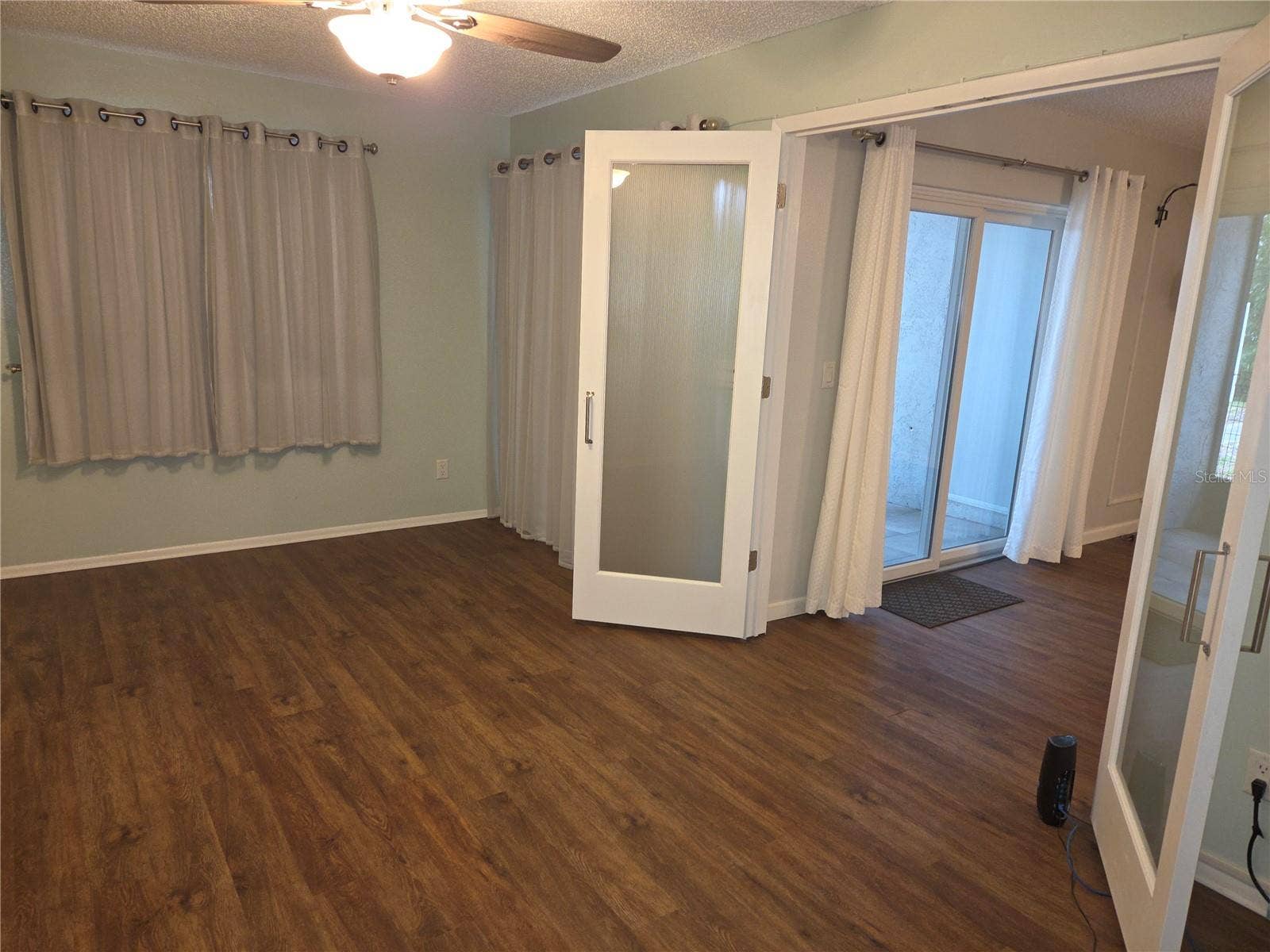 5943 CALAIS BOULEVARD N, #6, St Petersburg, FL 33714 Primary bedroom has a French door entrance from the living room.