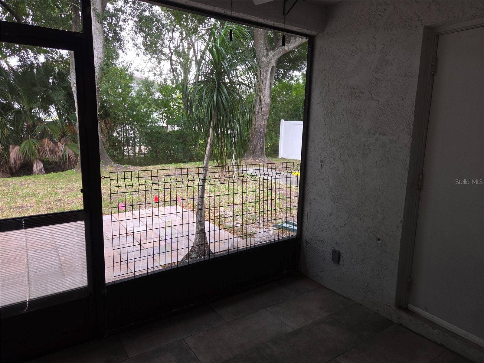 5943 CALAIS BOULEVARD N, #6, St Petersburg, FL 33714 Screened porch with utility closet and pavered patio