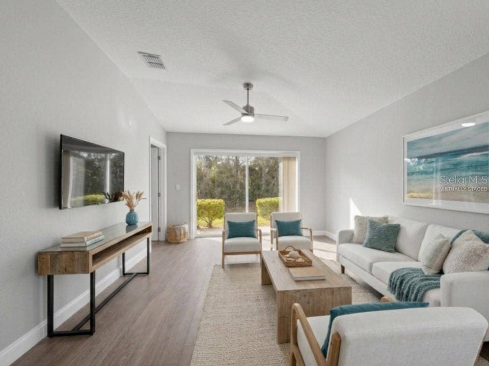 8516 CORINTHIAN WAY, New Port Richey, FL 34654 Living room (virtually staged)