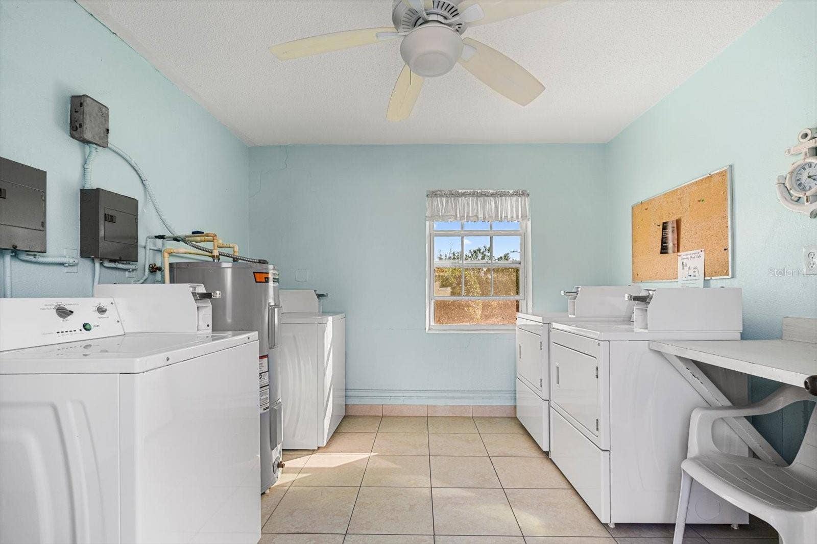 10351 REGAL DRIVE, #4, Largo, FL 33774 Common area laundry room in resident building.