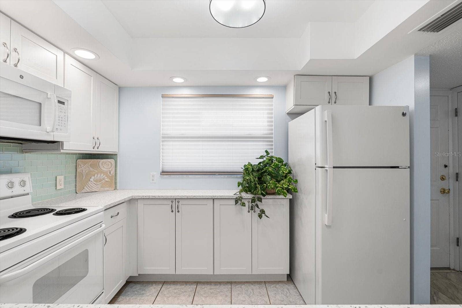 10351 REGAL DRIVE, #4, Largo, FL 33774 Whether looking for a primary or vacation home, this kitchen is fully equipped.