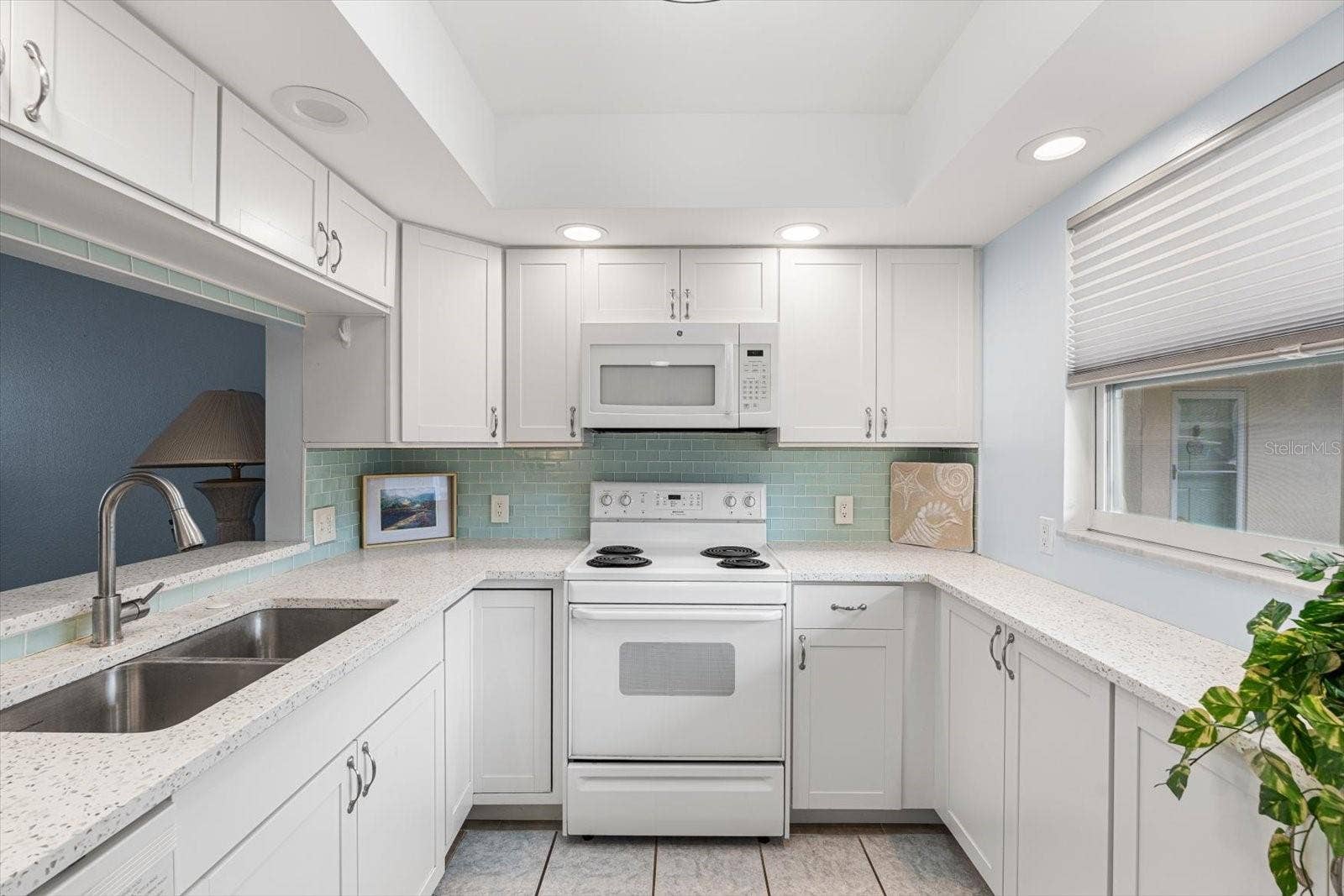 10351 REGAL DRIVE, #4, Largo, FL 33774 Abundant counter and cabinet spaces is offered.