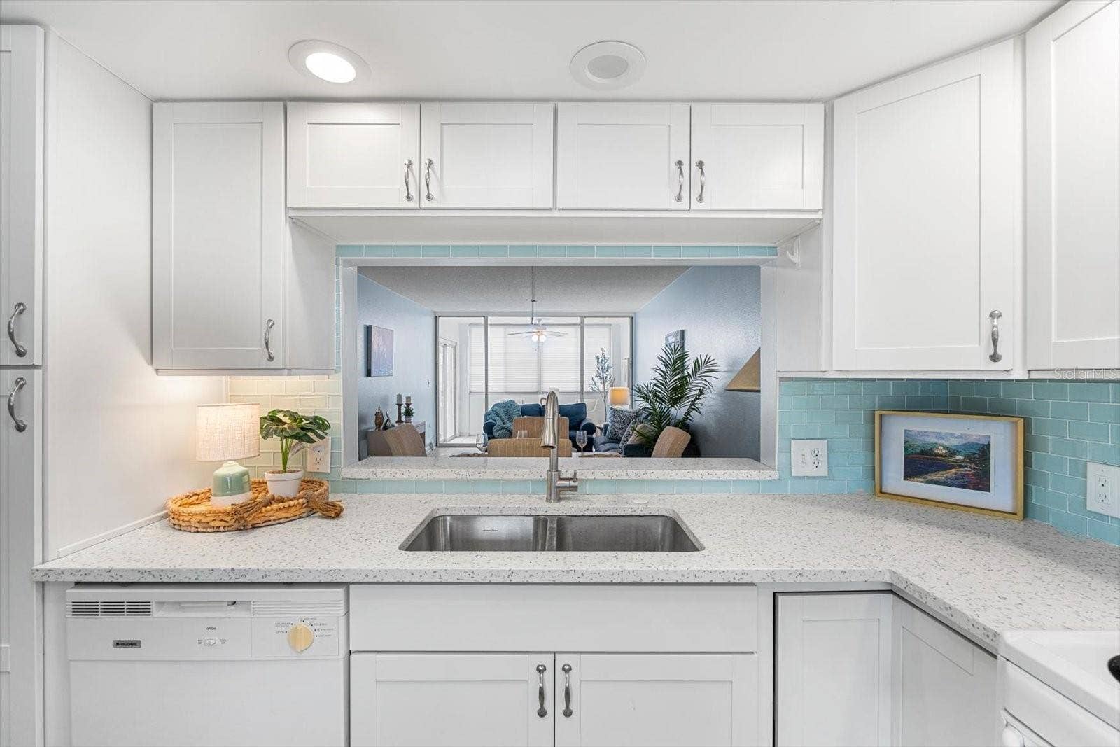10351 REGAL DRIVE, #4, Largo, FL 33774 Thoughtfully updated kitchen offers quartz countertops and views of the great room.