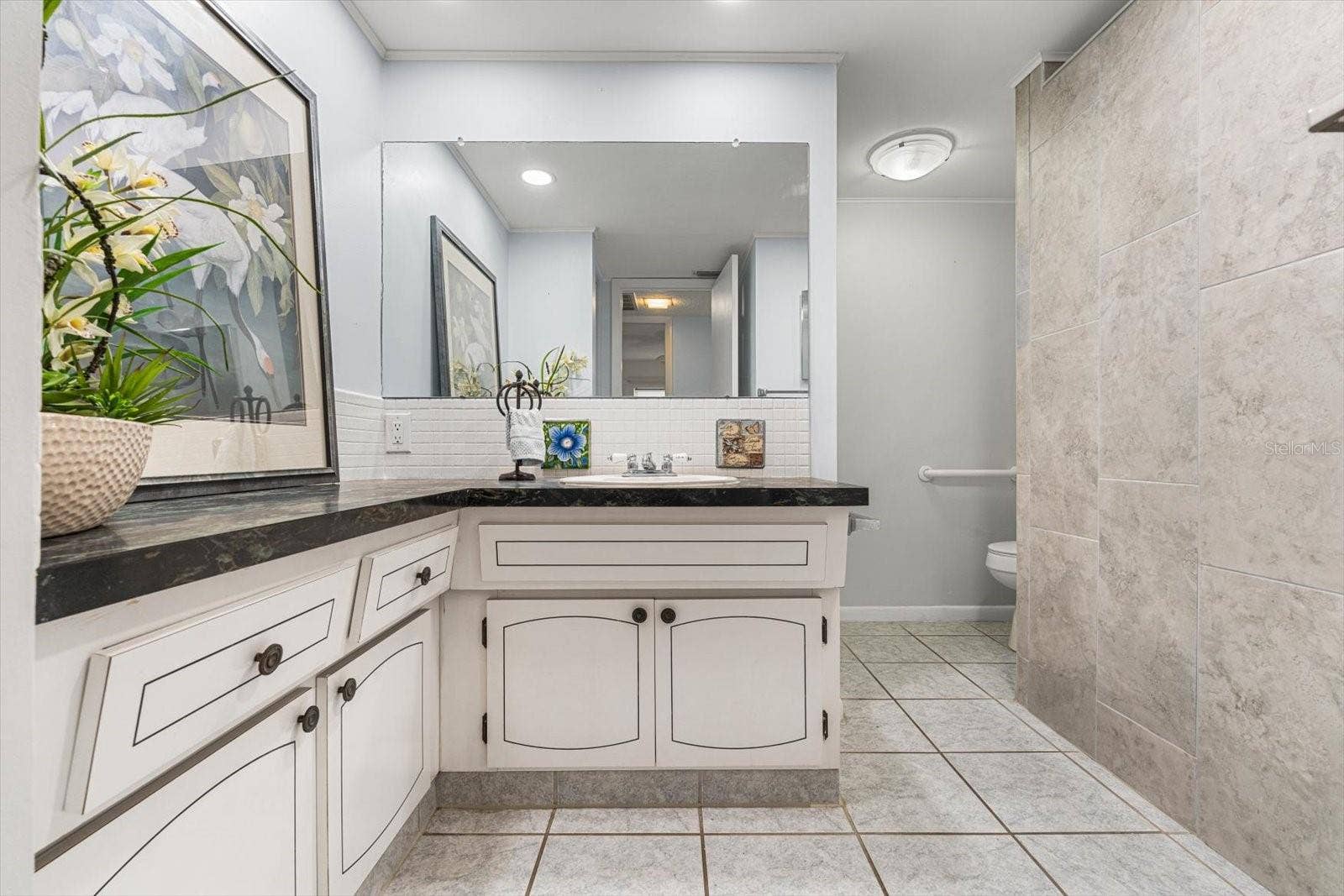 10351 REGAL DRIVE, #4, Largo, FL 33774 The primary bathroom, also used for guests, is spacious!