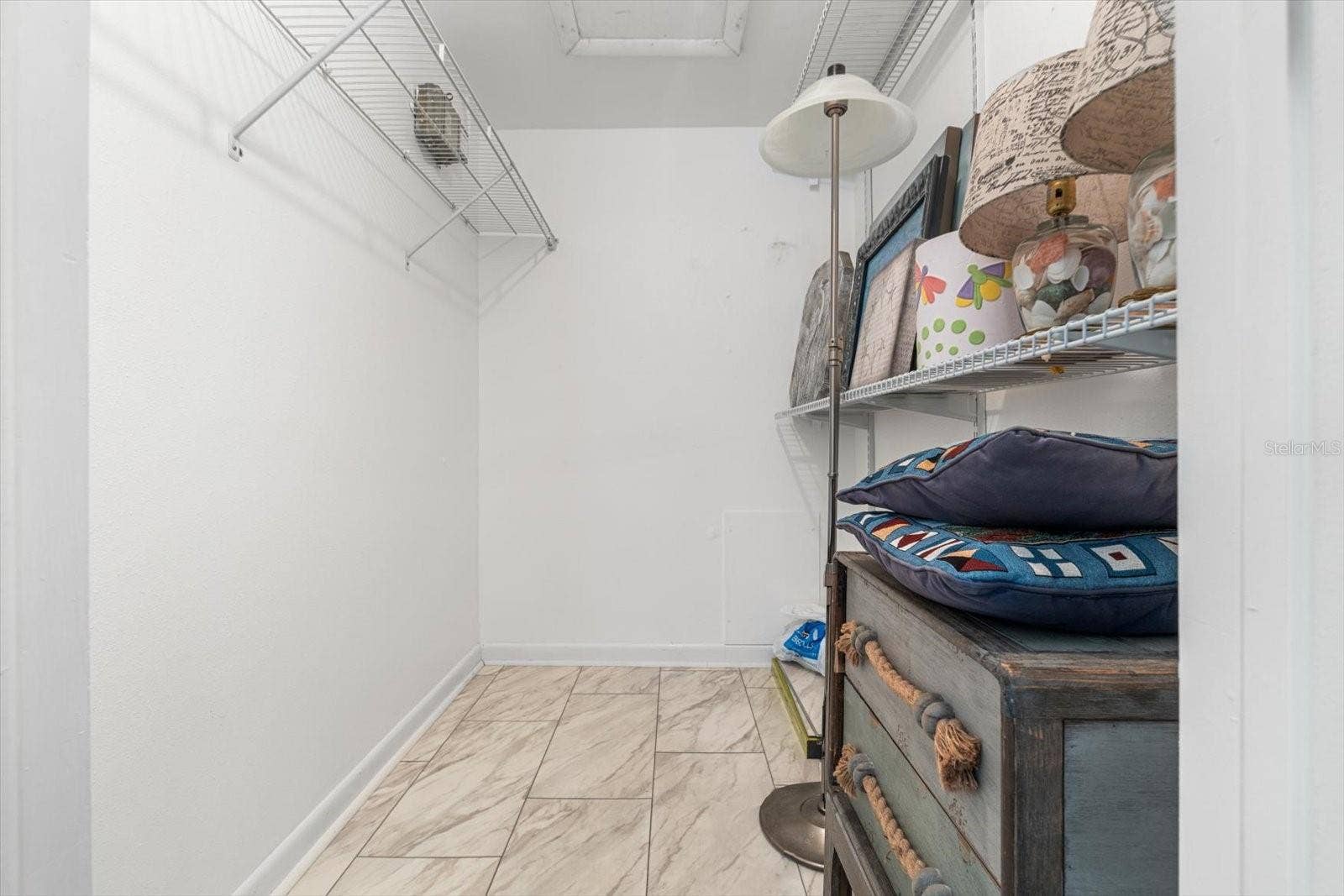 10351 REGAL DRIVE, #4, Largo, FL 33774 Ample-sized walk-in closet in the primary bedroom.