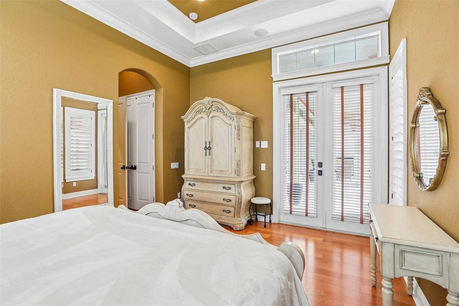 1st Floor Guest bedroom with en-suite bath and French doors to the pool.