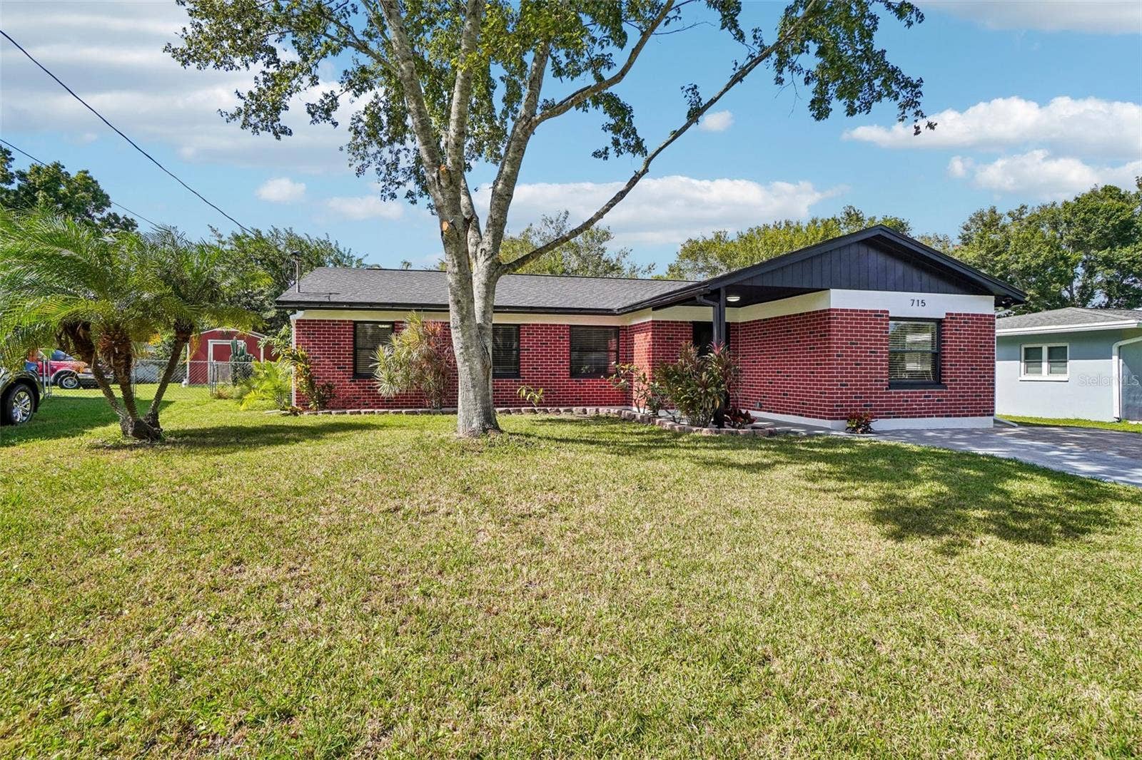 715 PAPAYA DRIVE, Tampa, FL 33619 Front from corner