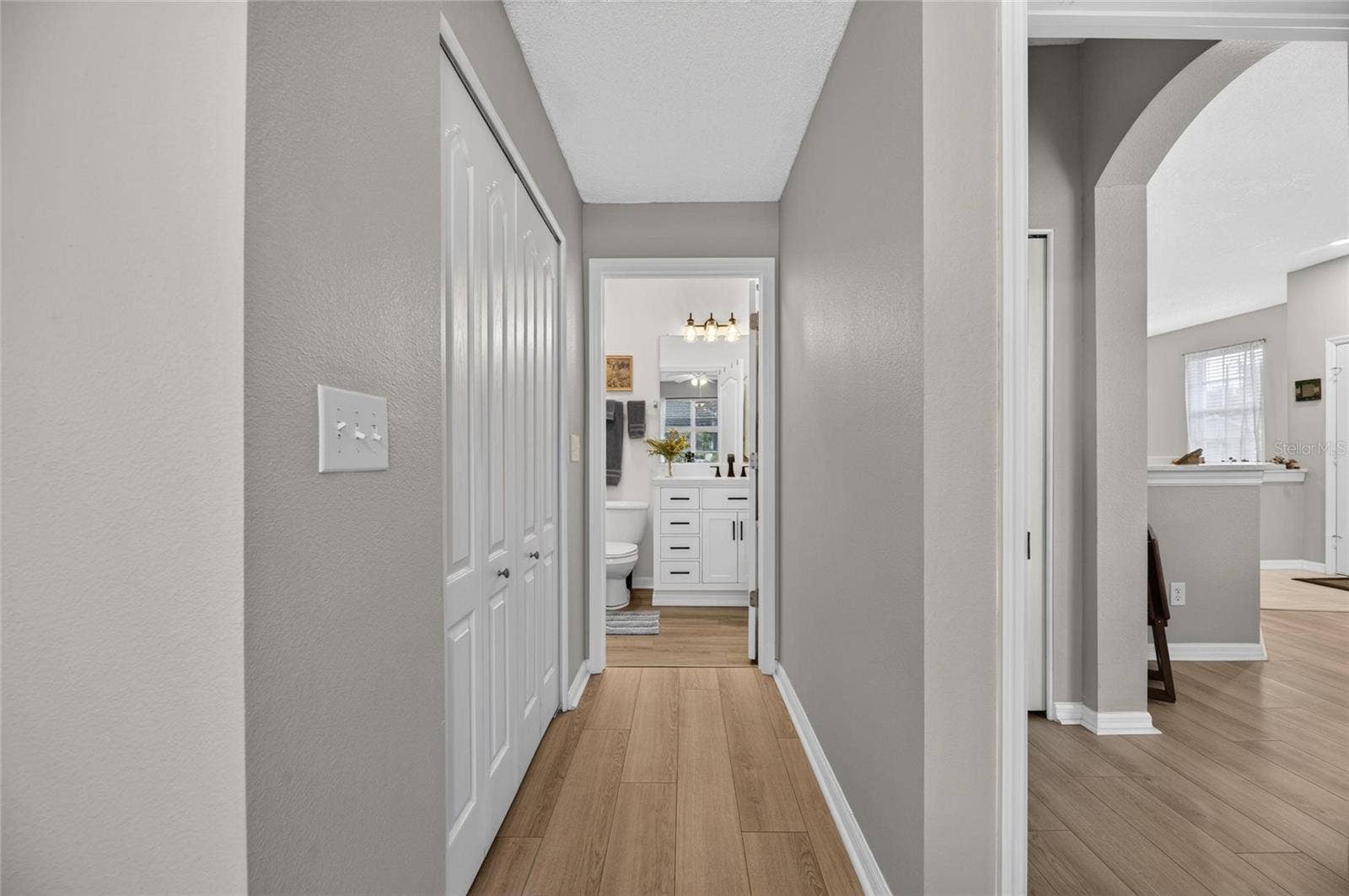 828 TREMONT GREENS LANE, #134, Sun City Center, FL 33573 Primary walk-in closet leading to ensiute bathroom