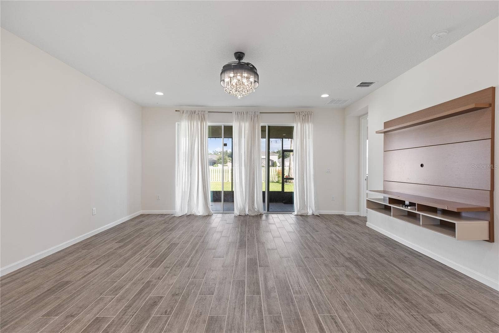 1007 LEE SHORE STREET, Valrico, FL 33594 Living room pic 3 Sliding glass doors