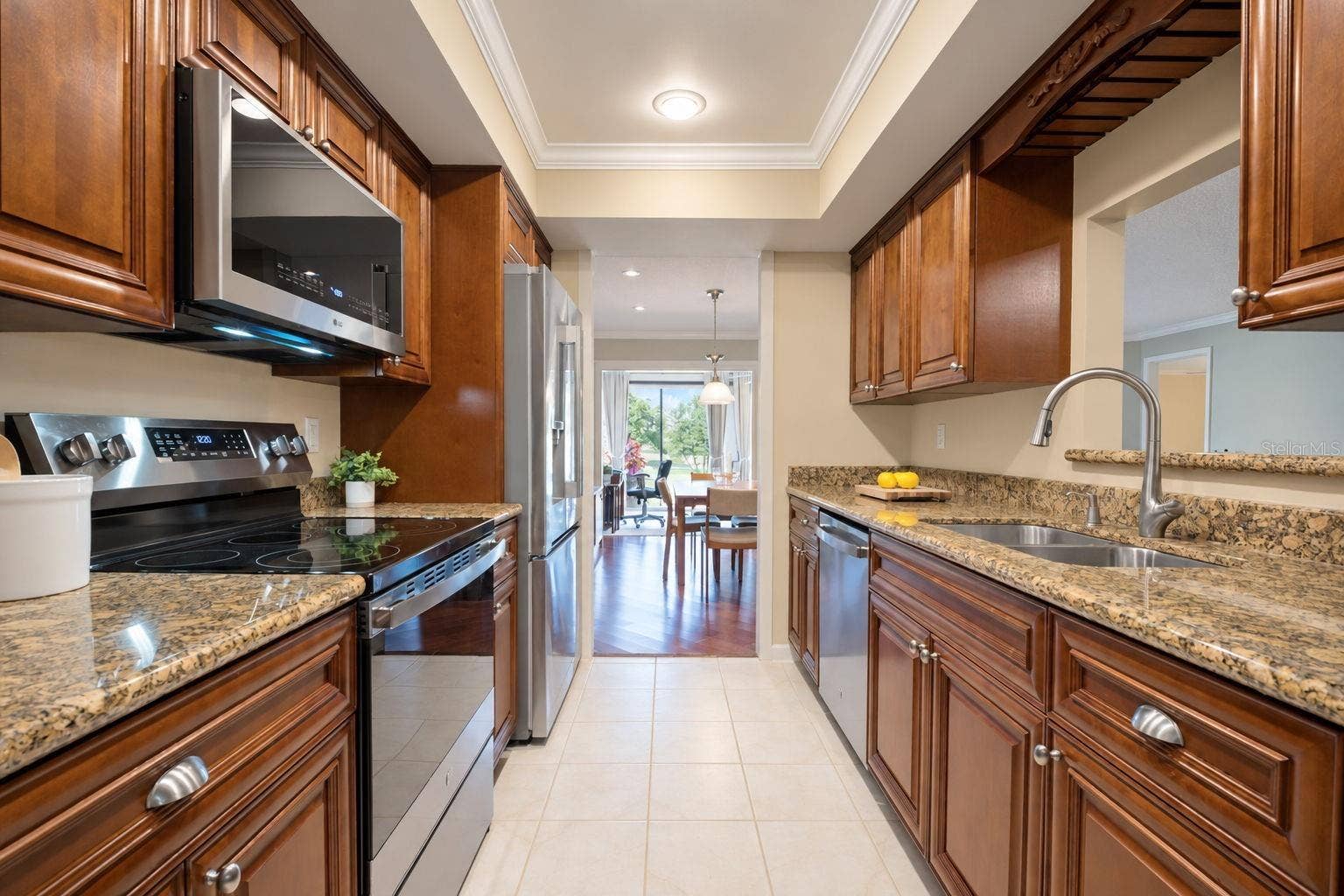 1146 RUSTLEWOOD COURT, Palm Harbor, FL 34684 Gorgeous solid wood cabinetry, granite countertops, and recessed lighting~
